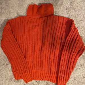 Orange turtleneck sweater
